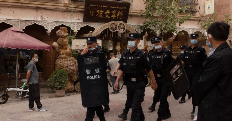 WIDER IMAGE In China's new Xinjiang: patriotic tourism, riot police and minders